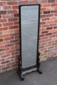 A CONTEMPORARY EBONISED CHEVAL MIRROR IN THE CHINESE STYLE, the rectangular double sided mirror