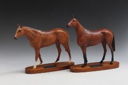 TWO LARGE BESWICK RACEHORSES ON PLINTHS, consisting of Red Rum and Grundy, H 28 cm, both marked as