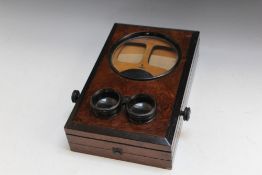 A WALNUT STEREOSCOPIC VIEWER, to include viewer cards showing San Francisco Earthquake and fire