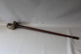 A GEORGE V OFFICERS DRESS SWORD IN LEATHER SCABBARD, belonging to Lieut. R.J. Beaumont, Middlesex