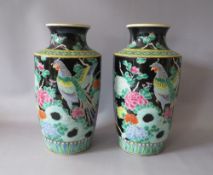 A PAIR OF ORIENTAL HIGH SHOULDERED FAMILLE NOIR VASES, having character marks to base, H 30 cm