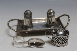 A SMALL COLLECTION OF SILVER CONSISTING OF A PAIR OF MIDDLE EASTERN CONDIMENTS ON A SMALL TRAY