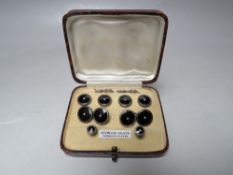 A CASED SET OF VINTAGE STERLING SILVER SHIRT AND COLLAR STUDS, with black enamel and seed pearl