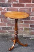 A 19TH CENTURY OAK PEDESTAL TABLE, the circular fixed top supported on a slender turned column and