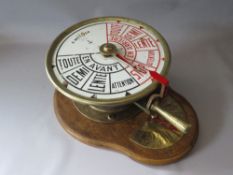 A BRASS CASED SHIPS TELEGRAPH WITH INCLINOMETER BY A METAYER OF PARIS, mounted on an oak wall board,