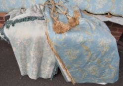 A PAIR OF BLUE & CREAM PATTERNED INTERLINED CURTAINS WITH GOLD TASSEL EMBELLISHMENT AND TASSEL TIE