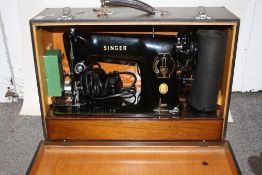 A CASED SINGER ELECTRIC 201K SEWING MACHINE WITH ACCESSORIES