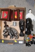A BOX OF COLLECTABLES TO INCLUDE EBONISED CARVED WOODEN BUSTS, FRAME AND GLAZED CAP BADGES AND