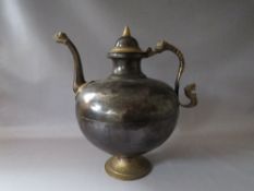 A LARGE VINTAGE EASTERN METAL DECORATIVE KETTLE / POURING VESSEL, with applied mask embellished