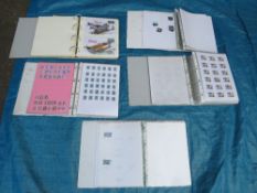 THREE ALBUMS OF MOSTLY BRITISH STAMPS, TOGETHER WITH AN EMPTY ALBUM AND AN ALBUM OF SPITFIRE RELATED