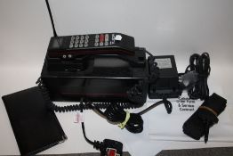 A VINTAGE BRITISH TELECOM CELLULAR TELEPHONE WITH PAPERWORK