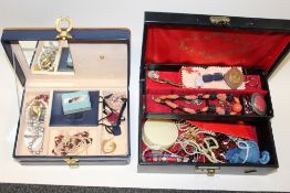TWO JEWELLERY BOXES CONTAINING COSTUME JEWELLERY TO INCLUDE A CARVED CORAL NECKLACE, AGATE BEAD