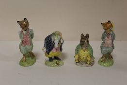 FOUR BESWICK BEATRIX POTTER FIGURES COMPRISING SAMUEL WHISKERS, TOMMY BROCK AND TWO FOXY WHISKERED
