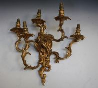 A LATE 19TH / EARLY 20TH GILT METAL FIVE BRANCH WALL APPLIQUE IN THE ROCOCO STYLE, wired for