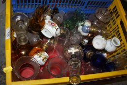 A COLLECTION OF VINTAGE OIL LAMPS AND FLUES ETC.