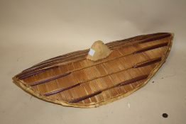 AN EAST AFRICAN TRIBAL ART WOVEN WICKER SHIELD