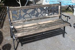 A GARDEN BENCH WITH CAST ENDS