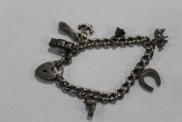 A VINTAGE HALLMARKED SILVER CHARM BRACELET APPROX WEIGHT - 30.3G