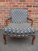 A CONTEMPORARY FRENCH STYLE UPHOLSTERED ARMCHAIR