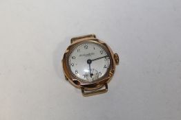 A VINTAGE MANUAL WIND 9 CARAT GOLD WRIST WATCH BY THOMAS RUSSELL & SON