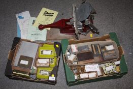 A VINTAGE ADANA FIVE-THREE PRINTING MACHINE WITH TWO BOXES OF PRINTING BLOCKS AND INSTRUCTIONS
