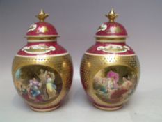 A PAIR OF ROYAL VIENNA GILDED PORCELAIN LIDDED VASES, each with blue beehive mark and titled in
