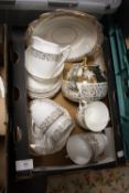 A TRAY OF DIAMOND CHINA CUPS AND SAUCERS, TOGETHER WITH A MATCHED GIBSON TEAPOT