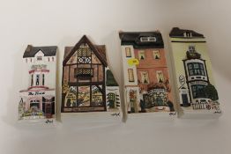 A SET OF FOUR HAZLE 'A NATION OF SHOPKEEPERS' FLATBACK WALL PLAQUES
