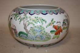 AN ORIENTAL CHINESE STYLE LOW BOWL, with scenes of children playing and flying kites, character mark