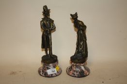A PAIR OF MODERN REPRODUCTION BRONZE EFFECT DOG AND CAT CHARACRATURE FIGURES H 26 CM