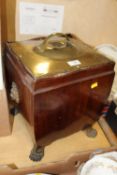A BRASS LIDDED MAHOGANY COAL BOX RAISED ON PAW FEET OVERALL HEIGHT - 44CM