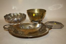 AN EASTERN WHITE METAL TRI-FOOTED BOWL TOGETHER WITH AN ARTS AND CRAFTS BRASS BOWL ON FEET, A