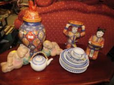 TWO MODERN CHINESE/ ORIENTAL HAND PAINTED FIGURES HOLDING BOWLS WITH ORANGE BACK STAMPS TALLEST