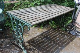 A GARDEN TABLE WITH CAST LEGS