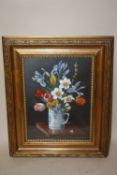 A GILT FRAMED AND GLAZED STILL LIFE OIL PAINTING OF FLOWERS IN A MUG SIGNED W. BADILELLEY LOWER