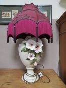 A LARGE CERAMIC TABLE LAMP WITH RED SHADE - OVERALL H-71 CM