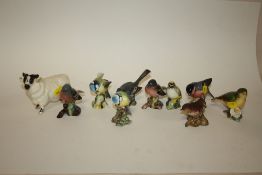 A COLLECTION OF NINE BESWICK BIRDS TOGETHER WITH A BESWICK FIGURE OF A RAM (10)