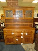 A LARGE AND HEAVY OAK GLAZED KITCHEN DRESSER, H 193 cm, W 162 cm