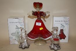 A MURANO STYLE STUDIO GLASS FIGURE OF A LADY IN A RED DRESS TOGETHER WITH TWO BOXED 'AMELIA ART