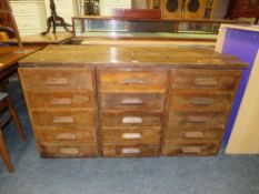 A VINTAGE OAK MULTI DRAWER INDUSTRIAL STYLE BANK OF FIFTEEN DRAWERS WITH RE-CLAIMED TOP H-75 W-144