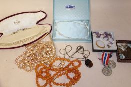 A BOX OF COSTUME JEWELLERY, COINS AND MEDALS ETC.