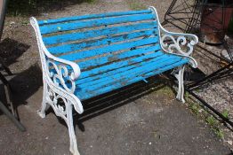 A GARDEN BENCH WITH CAST ENDS