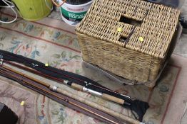 THREE FISHING RODS PLUS A WICKER BASKET