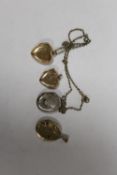 THREE ROLLED GOLD LOCKETS TOGETHER WITH A SILVER EXAMPLE