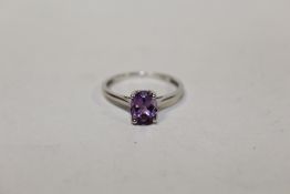 A STERLING SILVER AND AMETHYST DRESS RING, RING SIZE N
