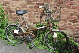 A RETRO RALEIGH BICYCLE WITH BASKET