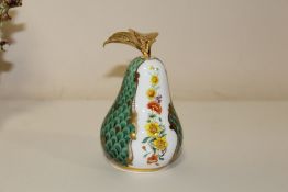 A ROYAL WORCESTER CONNOISSEUR COLLECTION CANDLE SNUFFER IN THE FORM OF A PERA