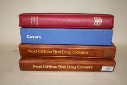 TWO ALBUMS OF POST OFFICE FIRST DAY COVERS TOGETHER WITH A STANLEY GIBBONS CHANNEL ISLANDS STAMP