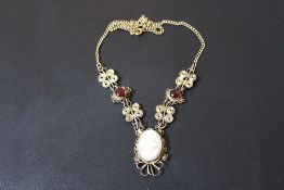 AN ANTIQUE CAMEO WIREWORK PENDANT, with red cabochon detailing,cameo measures H 2 cm