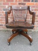 A MODERN HARDWOOD SWIVEL STYLE OFFICE ARMCHAIR